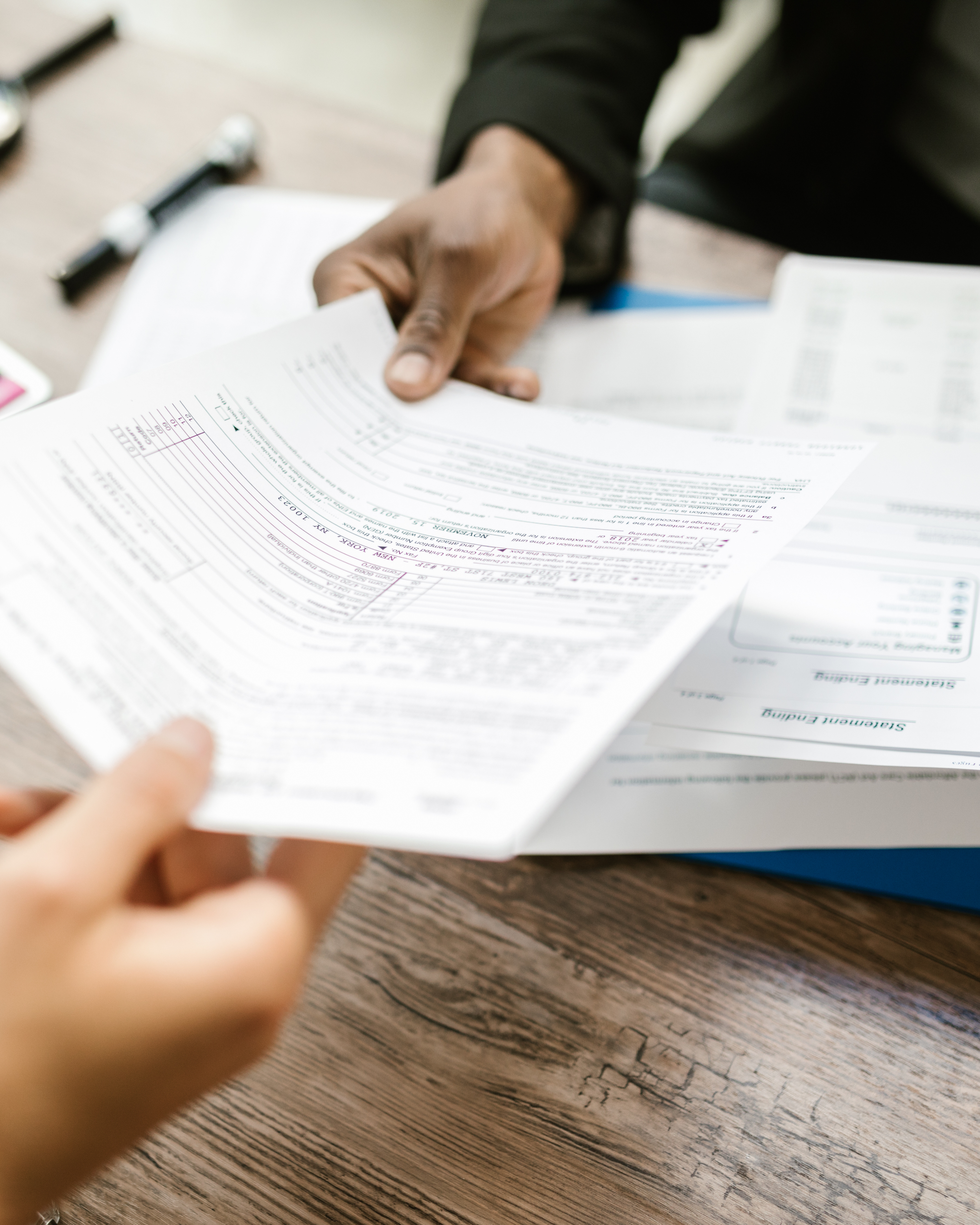 Professional freelancer in India reviewing legal documents on a workspace desk